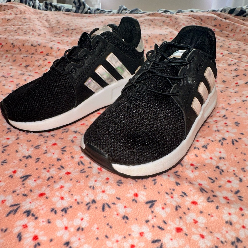 Adidas black sneakers with holographic stripes